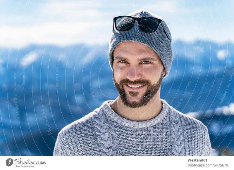 Germany, Bavaria, Brauneck, portrait of smiling man in winter in the mountains hibernal men males portraits mountainscape mountainscapes mountain scenery