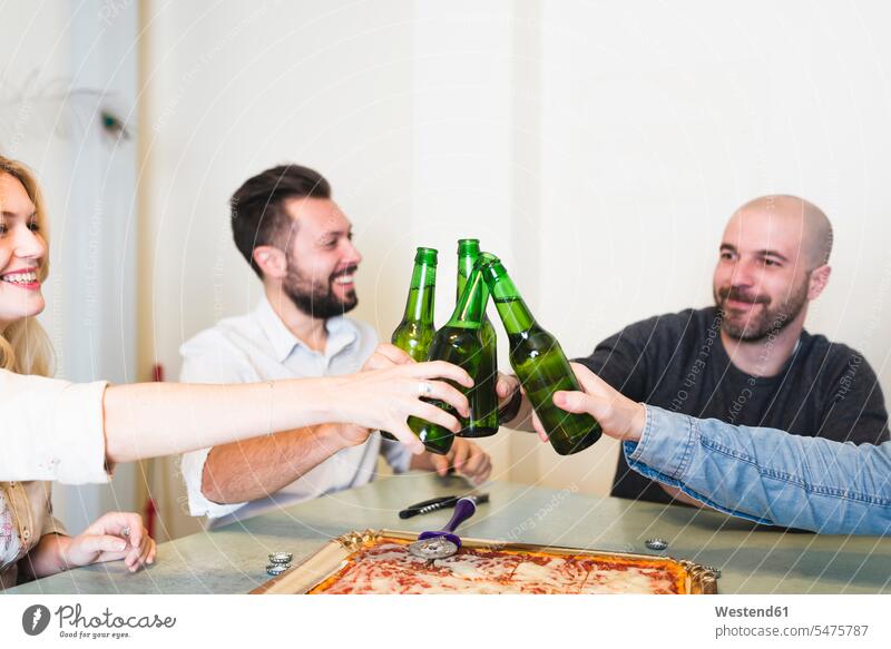 Colleagues having pizza and beer in office human human being human beings humans person persons caucasian appearance caucasian ethnicity european adult grown-up