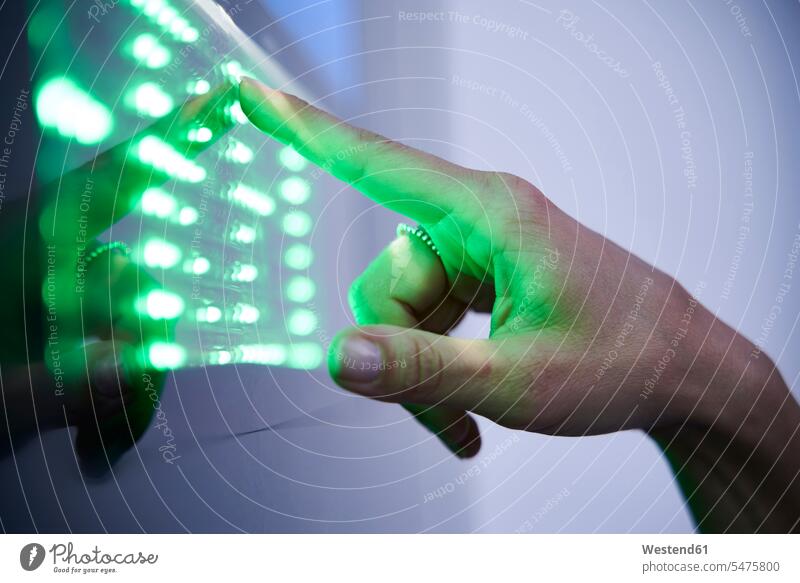 Detail of finger touching green led touchscreen human human being human beings humans person persons caucasian appearance caucasian ethnicity european 1