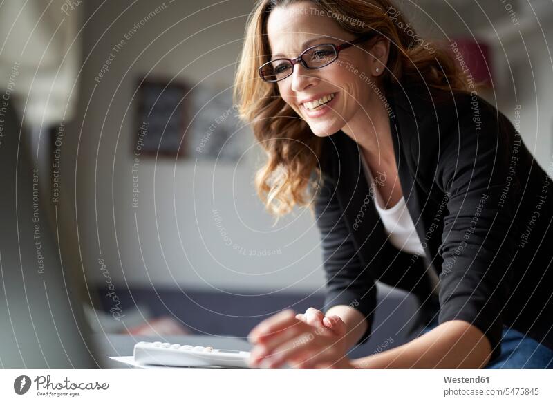 Happy woman using laptop at home human human being human beings humans person persons caucasian appearance caucasian ethnicity european 1 one person only