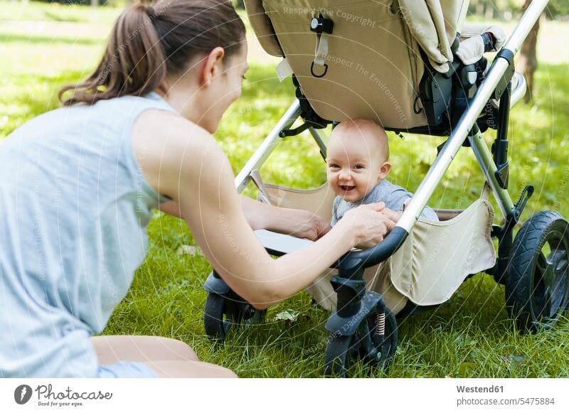 Portrait of laughing baby girl with her mother in a park human human being human beings humans person persons caucasian appearance caucasian ethnicity european
