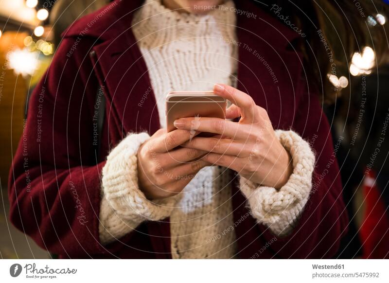 Hands of young woman holding smartphone, close-up telecommunication phones telephone telephones cell phone cell phones Cellphone mobile mobile phones mobiles