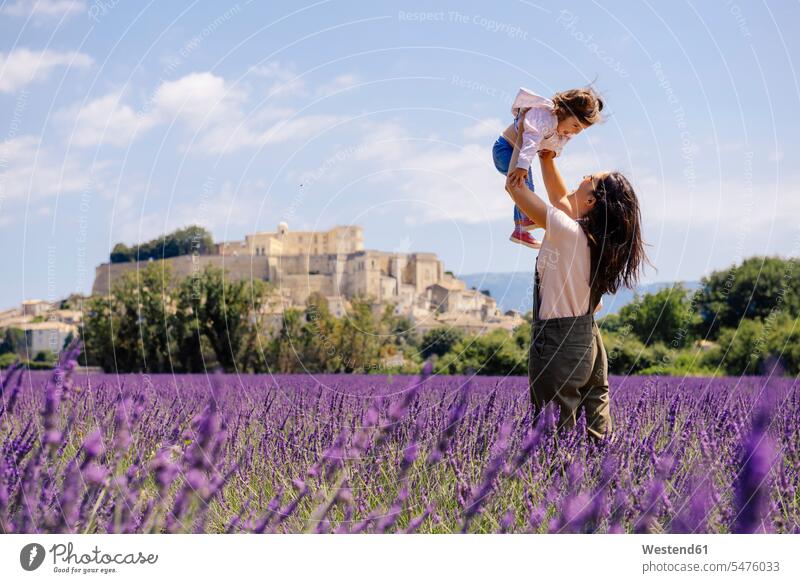 France, Grignan, mother and little daughter having fun together in lavender field Fun funny mommy mothers ma mummy mama daughters parents family families people