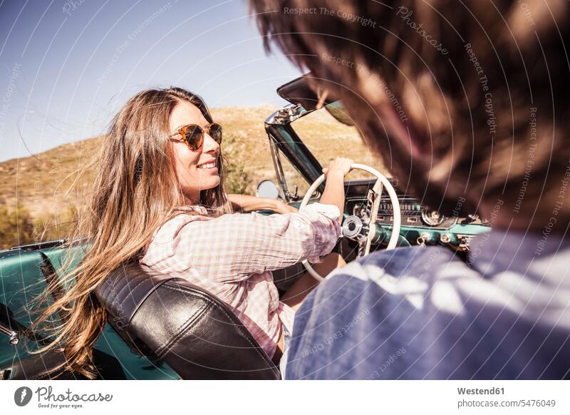 Couple in convertible car on a road trip human human being human beings humans person persons caucasian appearance caucasian ethnicity european 2 2 people