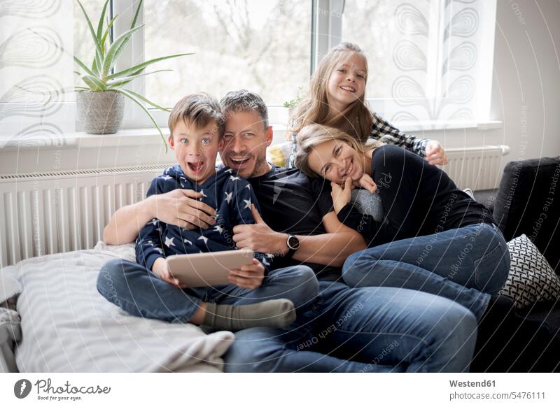 Portrait of playful family on couch at home human human being human beings humans person persons caucasian appearance caucasian ethnicity european Group