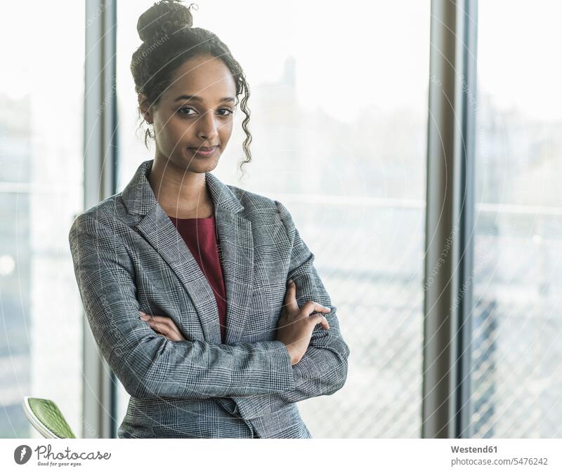 Portrait of a confident young businesswoman in office human human being human beings humans person persons Mixed Race mixed race ethnicity mixed-race Person 1
