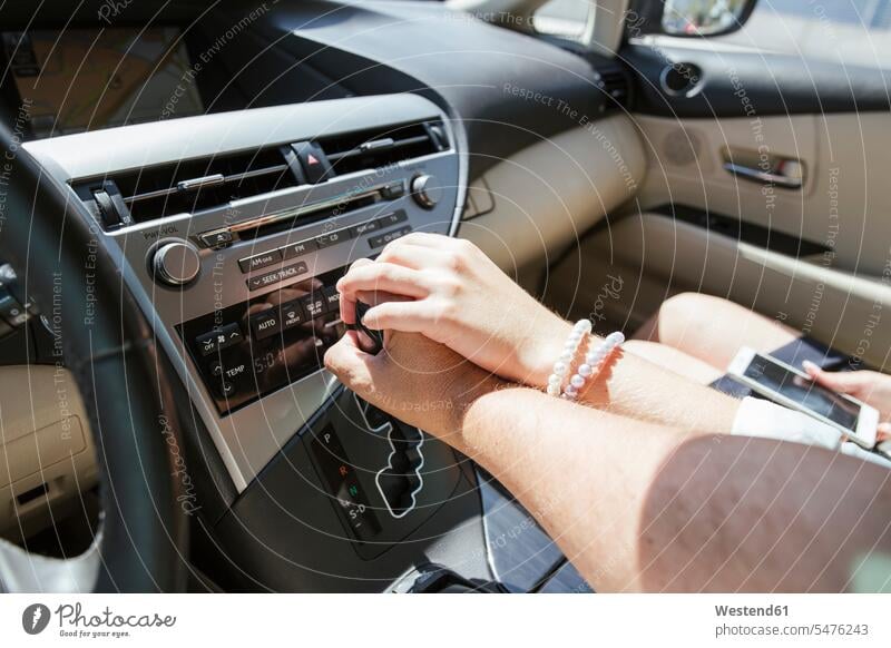 Couple holding hands in a car human human being human beings humans person persons caucasian appearance caucasian ethnicity european 2 2 people 2 persons two