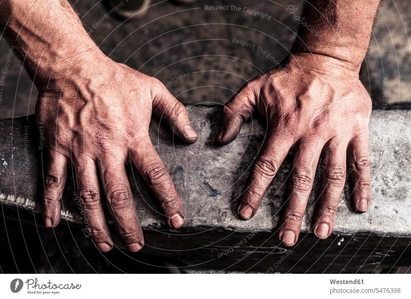 Knife maker with soot-blackened hands on anvil human human being human beings humans person persons caucasian appearance caucasian ethnicity european 1