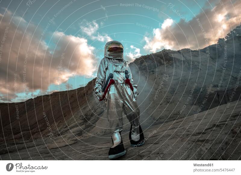 Spaceman exploring nameless planet, walking in a dust cloud astronaut astronauts planets unknown Exploration explore spaceman spacemen astronautics space travel