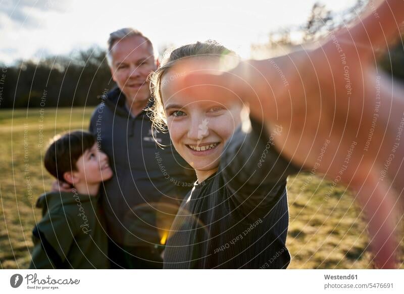 Portrait of happy girl with her family on a meadow human human being human beings humans person persons caucasian appearance caucasian ethnicity european Group