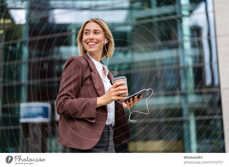 Happy young businesswoman in the city on the go business life business world business person businesspeople business woman business women businesswomen