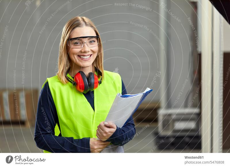 Portrait of smiling female worker in protective workwear human human being human beings humans person persons caucasian appearance caucasian ethnicity european