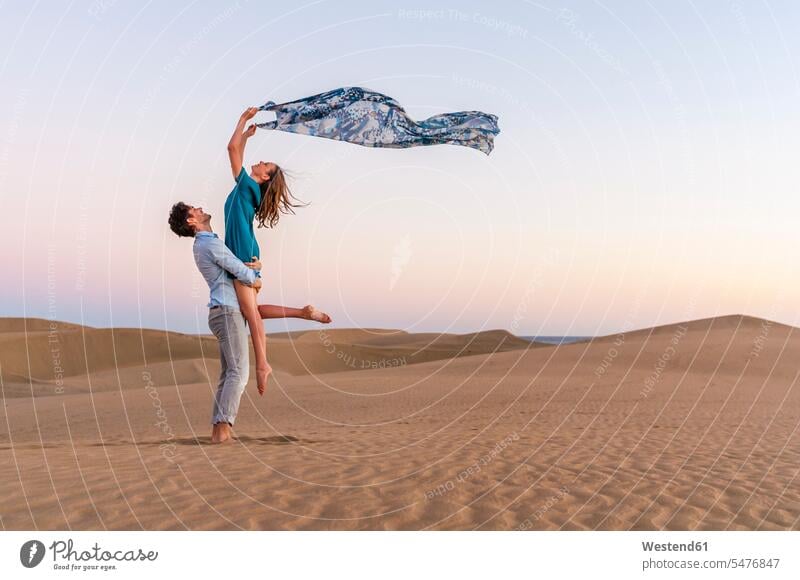 Carefree couple at sunset in the dunes, Gran Canaria, Spain human human being human beings humans person persons caucasian appearance caucasian ethnicity