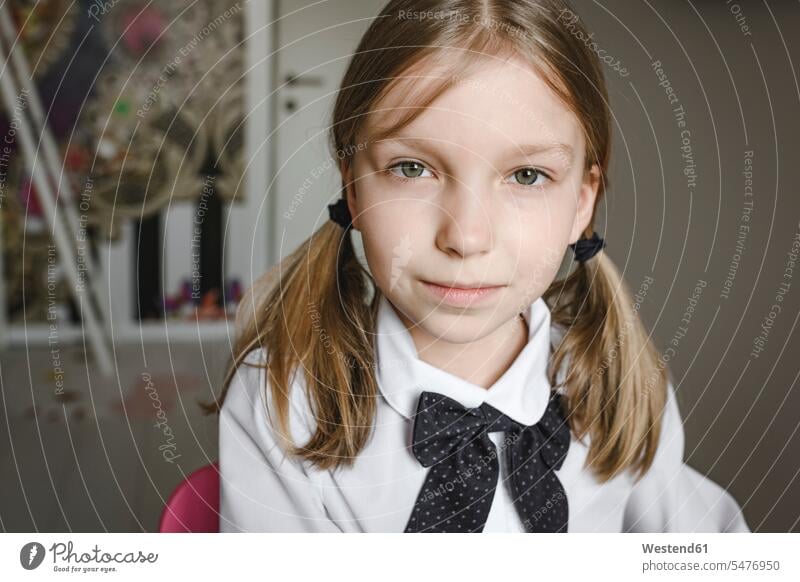 Portrait of a girl wearing bow and shirt bows Self-confidence self-confident poised Self-Assured Self-Assurance childhood females girls one person 1