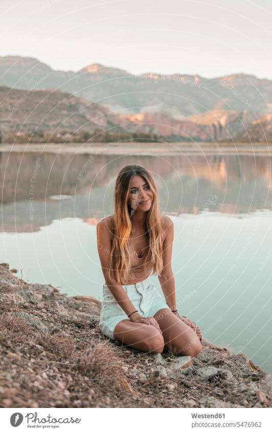 Young blond woman at a lake human human being human beings humans person persons caucasian appearance caucasian ethnicity european 1 one person only
