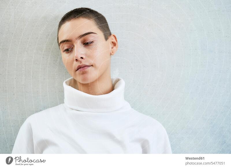 Portrait of thoughtful short-haired young woman portrait portraits females women short hair short hairs short hairstyles shorthaired pensive Reflective