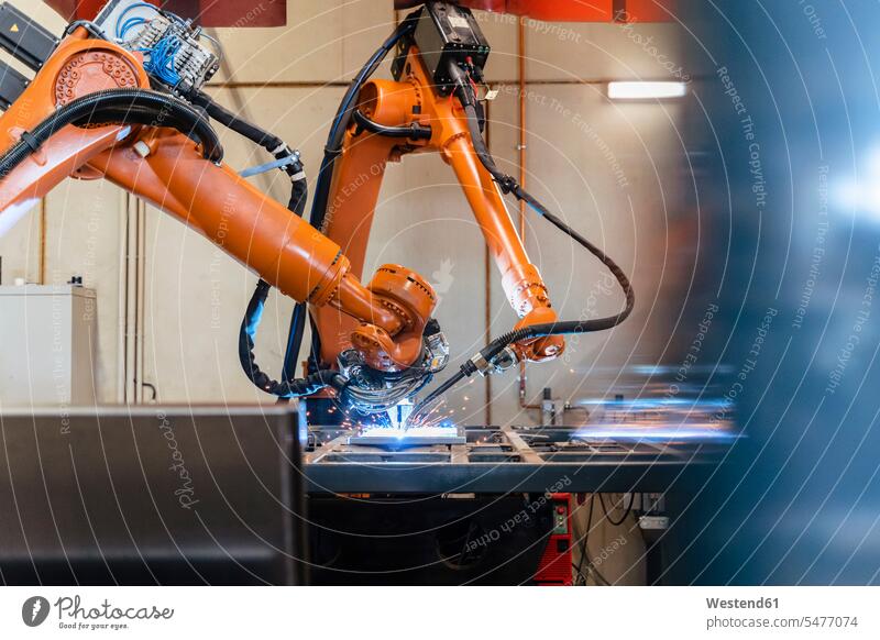 Robotic arms welding in industrial factory color image colour image indoors indoor shot indoor shots interior interior view Interiors Automated automatized