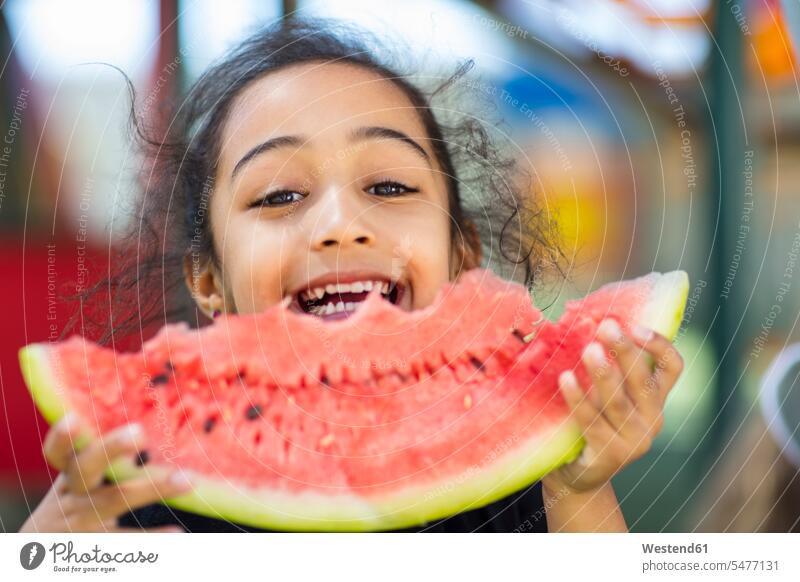 Portrait of happy girl eating a watermelon in kindergarten portrait portraits females girls nursery school Watermelon Watermelons Water Melon Water Melons