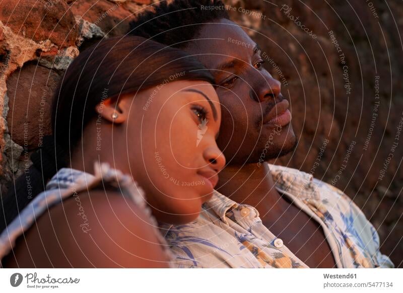 Portrait of a young couple in love happy Emotions Feeling Feelings Sentiment Sentiments loving caressing tender Affectionate community walls atmospheric