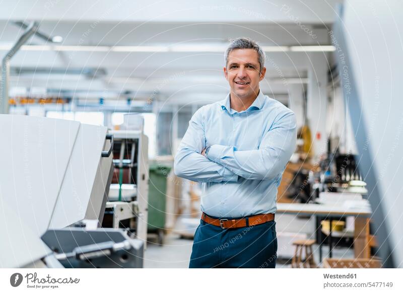 Portrait of a confident businessman in a factory human human being human beings humans person persons caucasian appearance caucasian ethnicity european 1