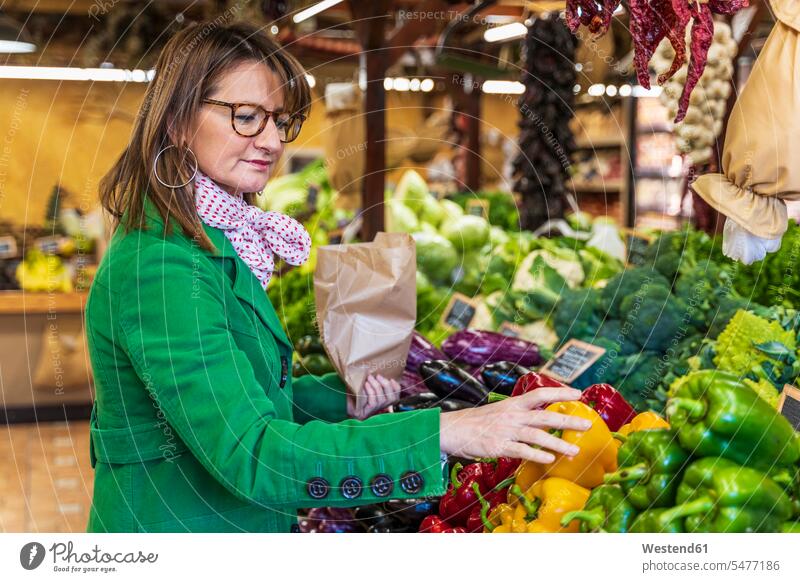 Woman shopping for fruit and vegetables in organic shop human human being human beings humans person persons caucasian appearance caucasian ethnicity european