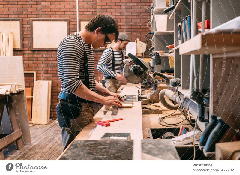 Carpenters at work in a workshop Occupation Work job jobs profession professional occupation crafts hand work handcraft handicraft handwork manual labour
