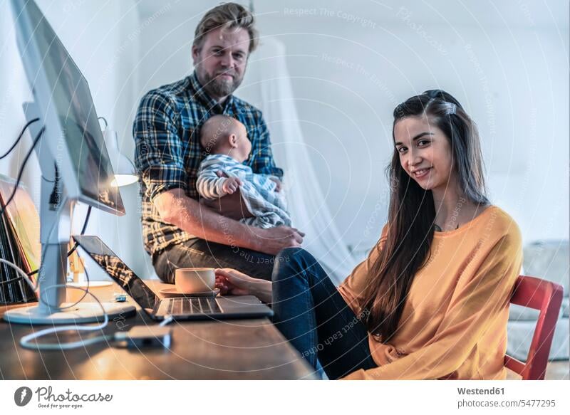 Portrait of young woman with her family in home office human human being human beings humans person persons caucasian appearance caucasian ethnicity european