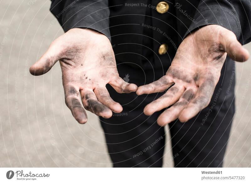 Close-up of dirty hands of a chimney sweep caucasian caucasian ethnicity caucasian appearance european Filthy cruddy outdoors outdoor shots location shot