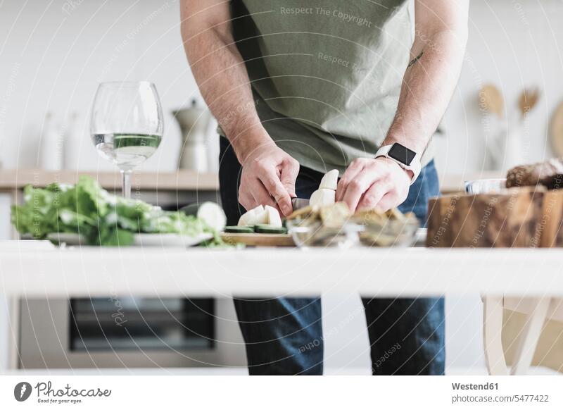 Man preparing salad at home, partial view man men males Food Preparation preparing food Salad Salads Adults grown-ups grownups adult people persons human being