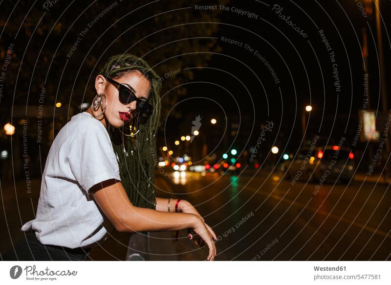 Cool young woman on a steet at night in the city human human being human beings humans person persons adult grown-up grown-ups grownup grownups young adult