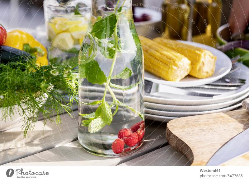Detox infused water on garden table Lifestyle Alimentation food Food and Drinks Nutrition healthy Health Lifestyle healthy lifestyles healthy living flavored