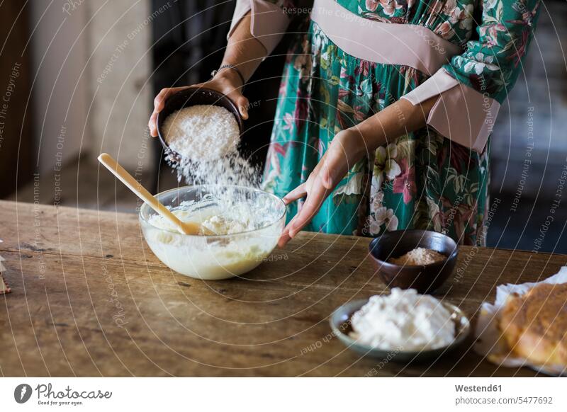Young woman preparing cake dough, partial view Food Preparation preparing food Cake Mixture cake batter cake mix females women foods food and drink Nutrition