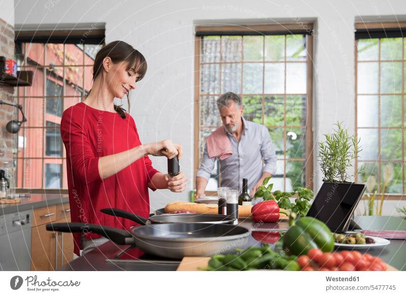 Couple in kitchen, preparing food toghether Food Preparation domestic kitchen kitchens couple twosomes partnership couples cooking together preparation prepare