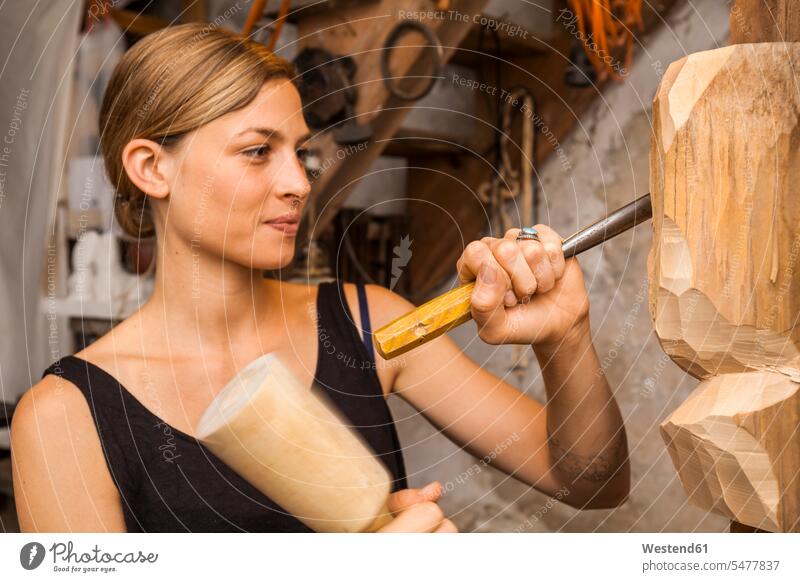 Sculptress carving wooden figure sculptress occupation profession professional occupation jobs Carving whittling female artist female artists woman females