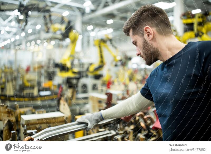 Man working in a modern factory human human being human beings humans person persons caucasian appearance caucasian ethnicity european 1 one person only