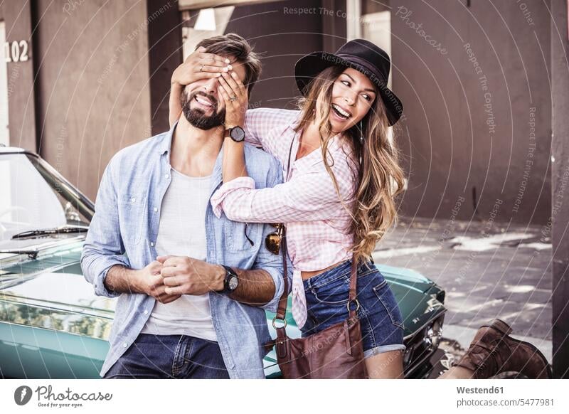 Happy couple at a convertible car outside house human human being human beings humans person persons caucasian appearance caucasian ethnicity european 2