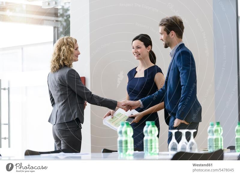 Business people shaking hands in office business life business world business person businesspeople associate associates business associate business associates