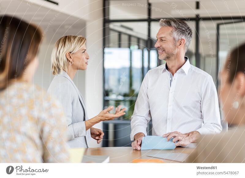 Businesswoman and businessman leading a meeting in office Occupation Work job jobs profession professional occupation business life business world