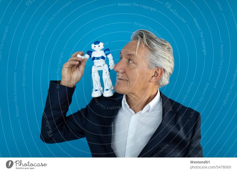 Senior businessman with robot on his shoulder Occupation Work job jobs profession professional occupation business life business world business person