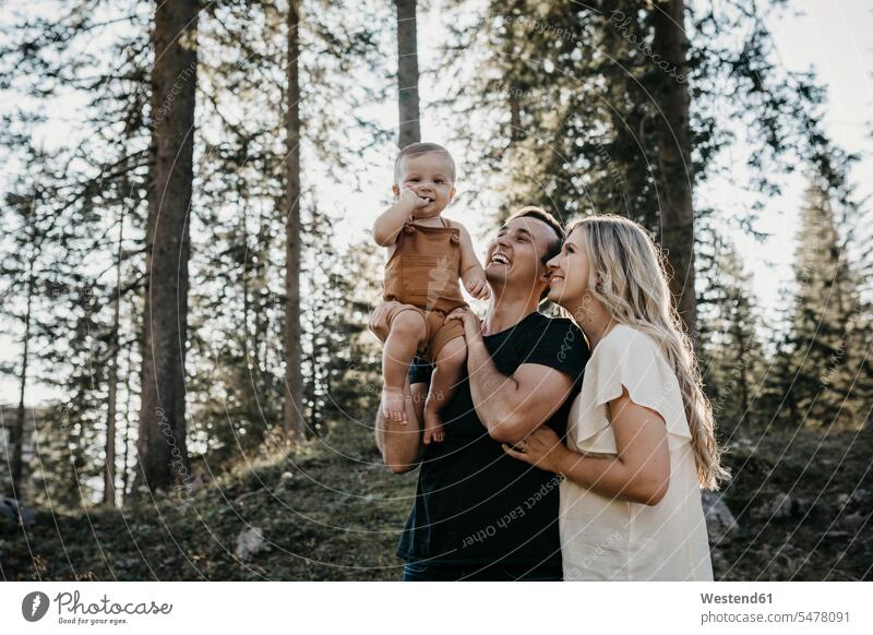 Happy family with little son on a hiking trip in a forest, Schwaegalp, Nesslau, Switzerland human human being human beings humans person persons