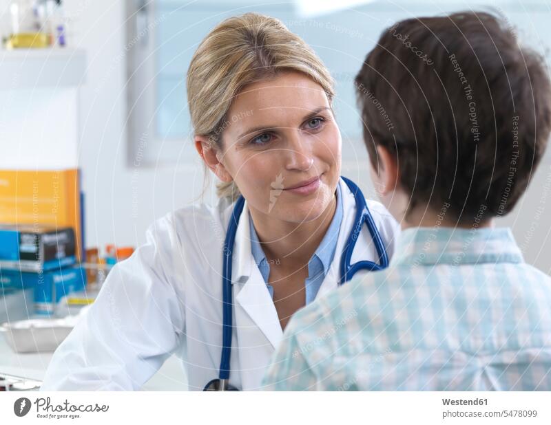 Female doctor reassuring a patient during an appointment in the clinic human human being human beings humans person persons caucasian appearance
