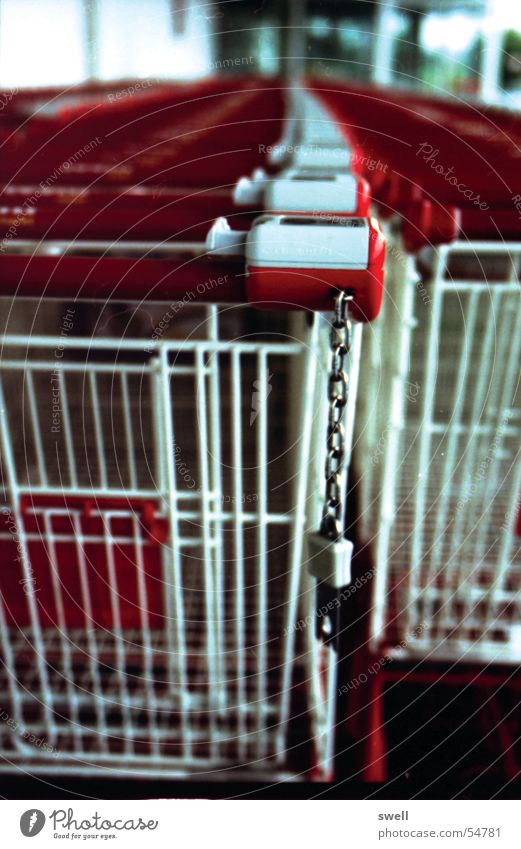 Tightly chained Shopping Trolley Supermarket Chain Row art