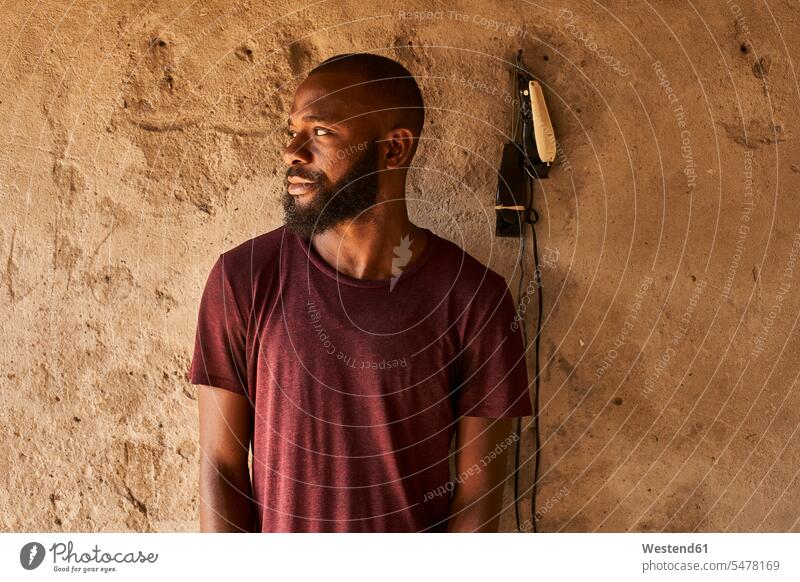 Mozambique, Maputo, portrait of bearded young man African descent black coloured one person 1 one person only only one person copy space Brown Background brown