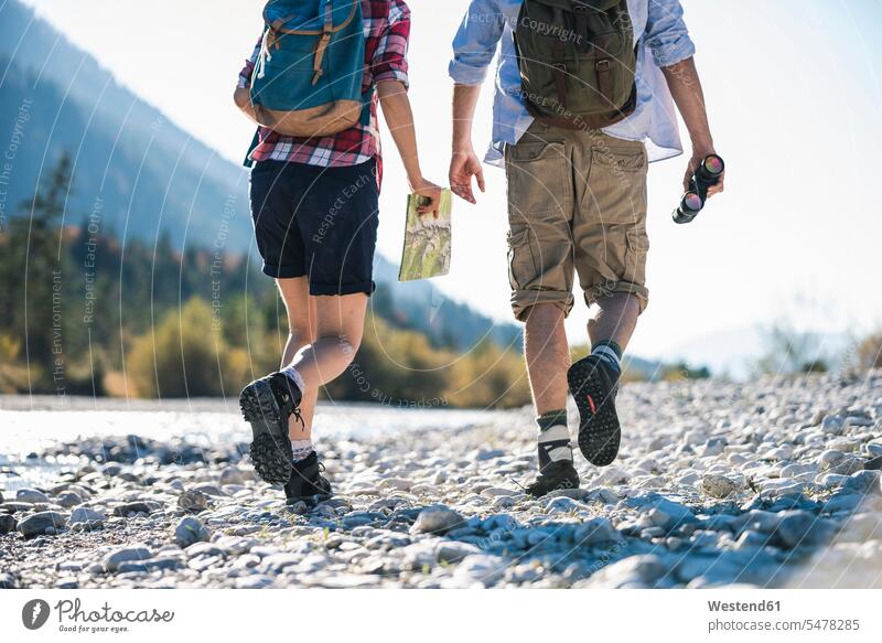 Austria, Alps, couple on a hiking trip with map and binoculars caucasian caucasian appearance caucasian ethnicity european White - Caucasian mature men
