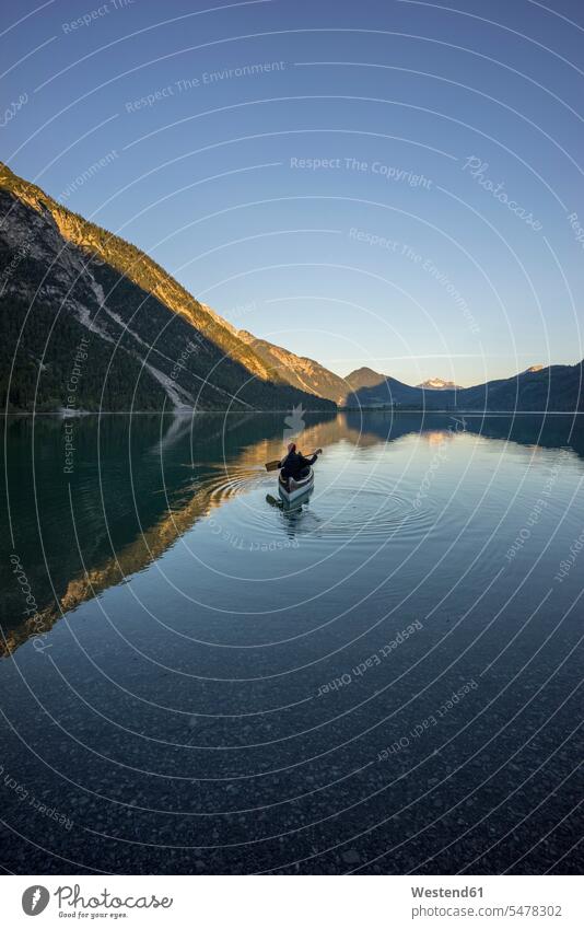 Canoe on Lake Plansee in the evening, Tyrol, Austria human human being human beings humans person persons adult grown-up grown-ups grownup grownups mid adult