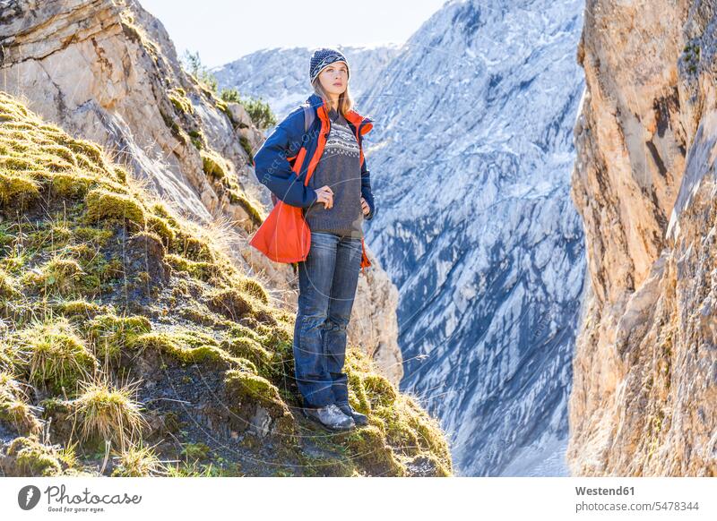 Germany, Garmisch-Partenkirchen, Alpspitze, Osterfelderkopf, female hiker on viewpoint looking at view leisure free time leisure time female wanderers woman