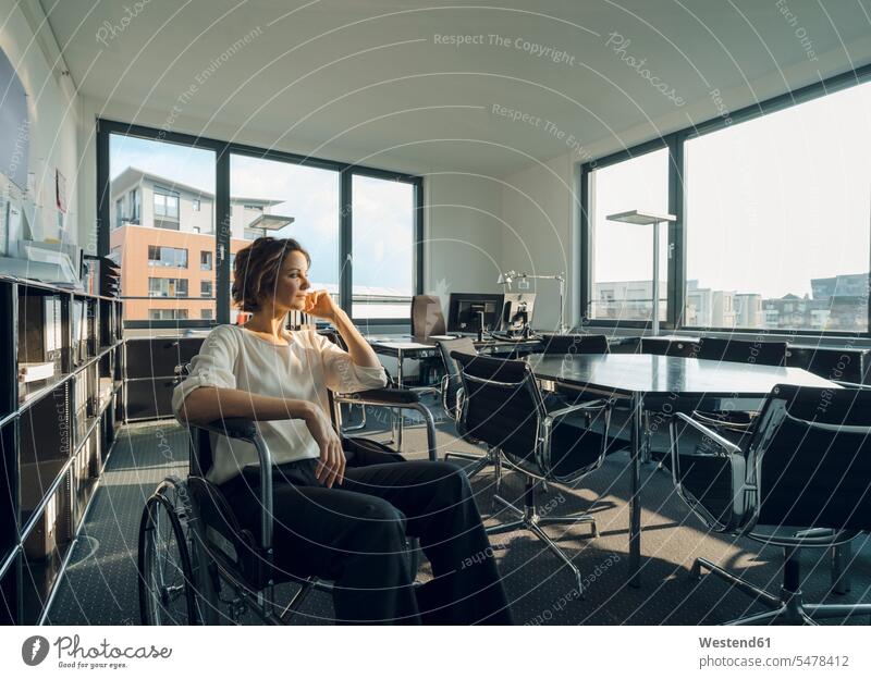 Disabled business woman sitting in wheelchair, smiling caucasian caucasian ethnicity caucasian appearance european equal opportunities opportunity copy space