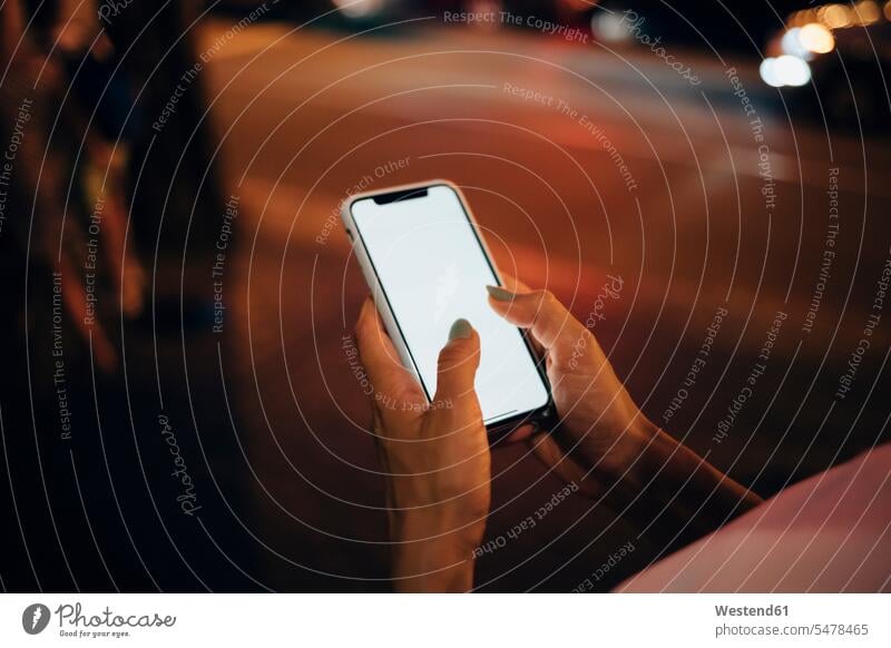 Hands of woman holding smartphone at night, close-up human human being human beings humans person persons 1 one person only only one person adult grown-up