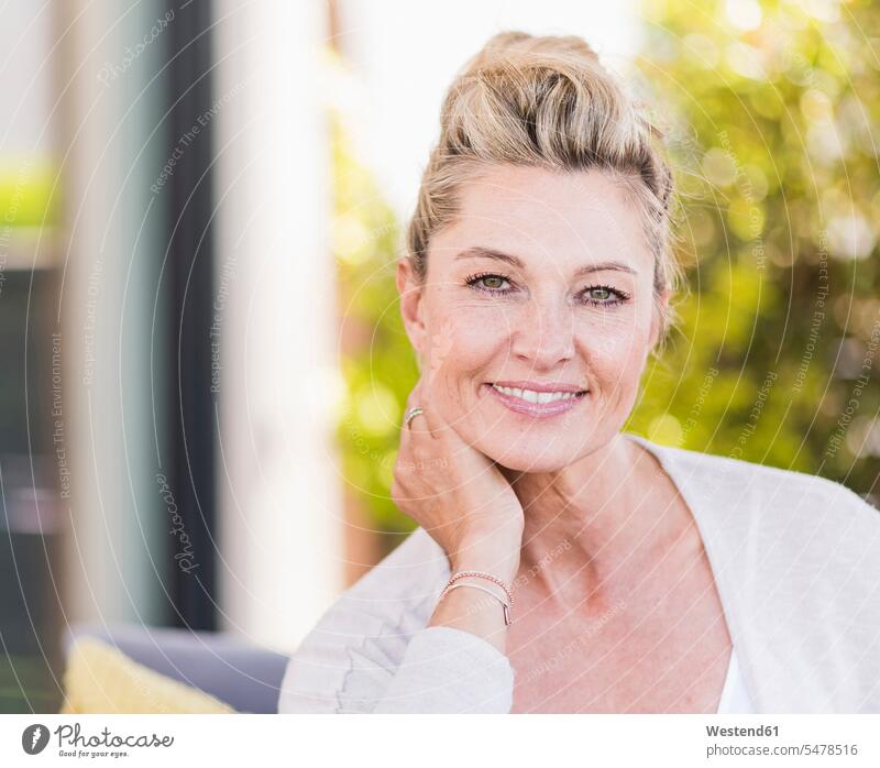 Portrait of smiling mature woman on terrace relax relaxing smile delight enjoyment Pleasant pleasure happy at home free time leisure time Lifestyle