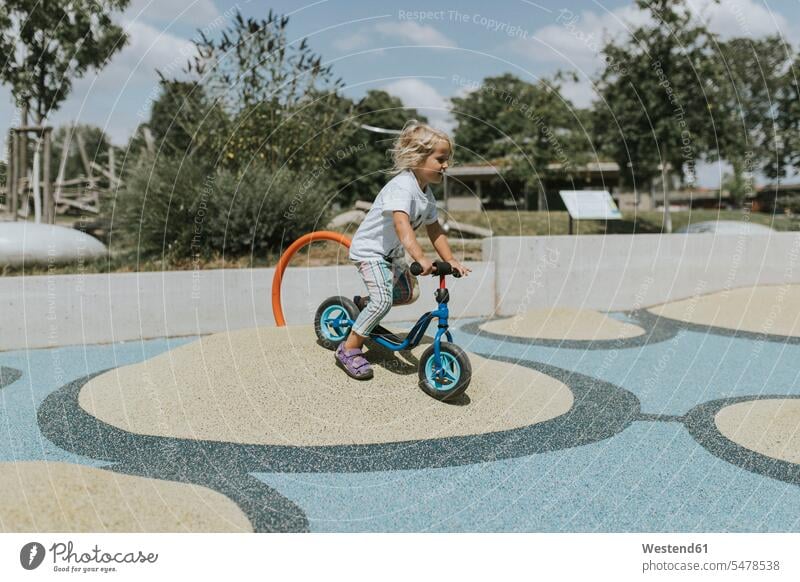 Happy girl riding scooter on a playground human human being human beings humans person persons caucasian appearance caucasian ethnicity european 1